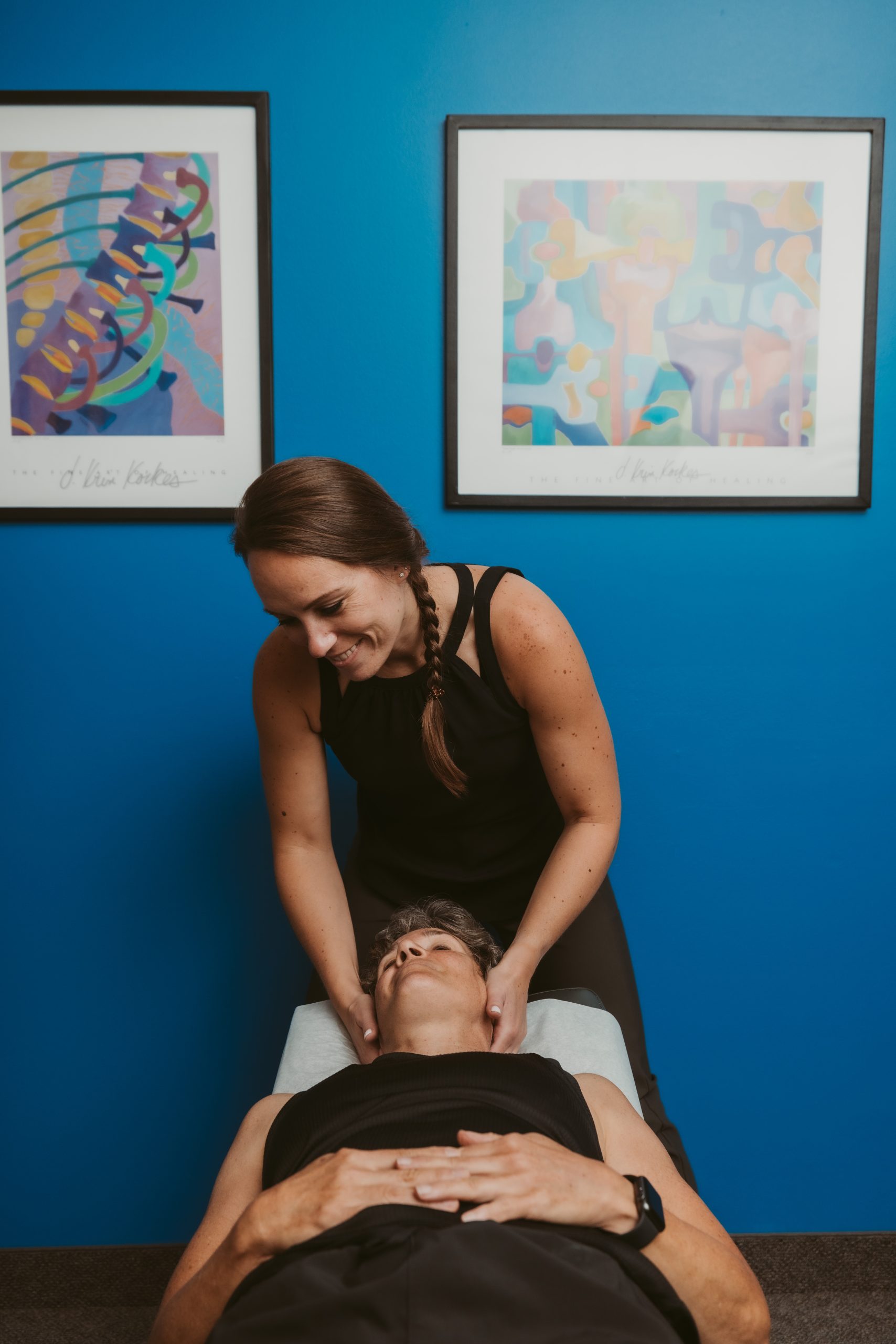 Dr. Christie adjusting a patients neck for a chiropractic treatment at Exuberance Chiropractic and Wellness